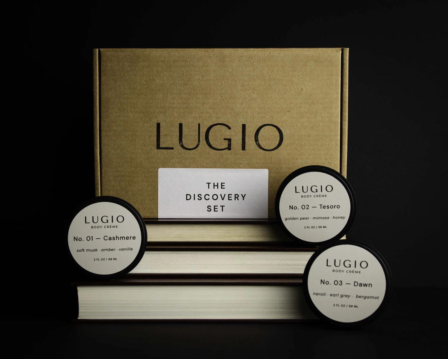 The Lugio Discovery Set: Cashmere, Tesoro and Dawn black tins with their stamped kraft box